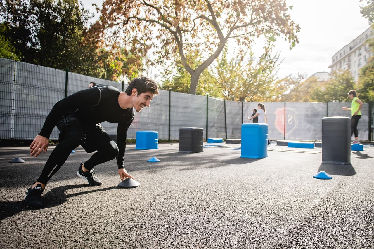 Fitness coach assisting client with workout, illustrating SEO case study success.